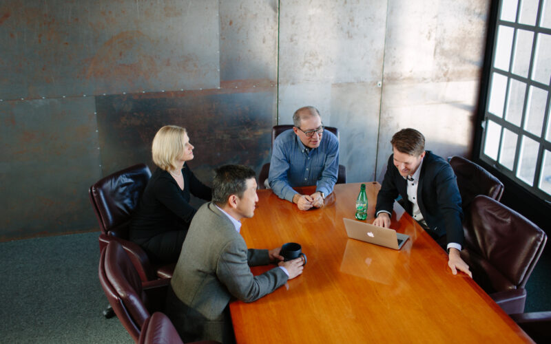 01-team-in-meeting-room